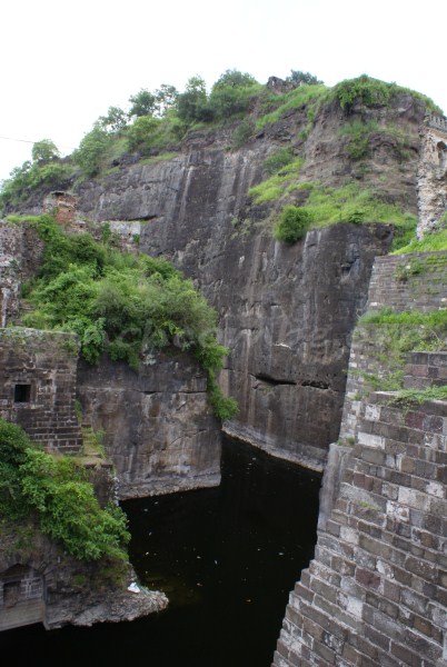 The rock cut walls and the moat below